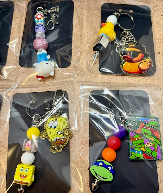 Riley's mystery pen or keychain item