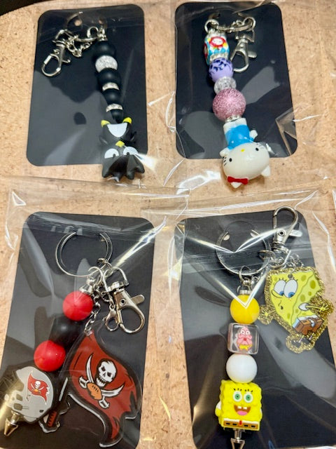 Riley's mystery pen or keychain item