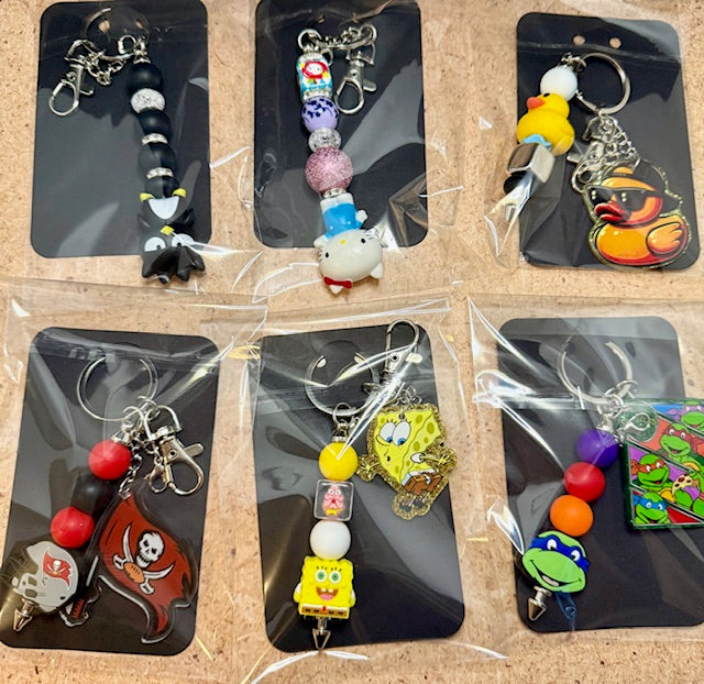 Riley's mystery pen or keychain item