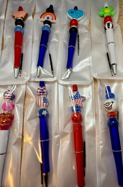 Riley's mystery pen or keychain item