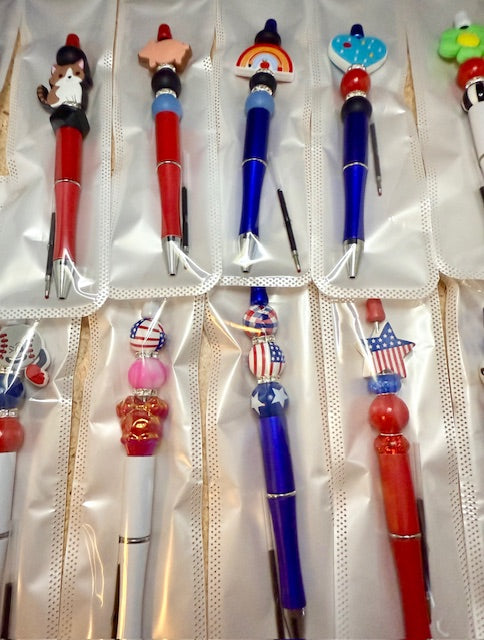 Riley's mystery pen or keychain item