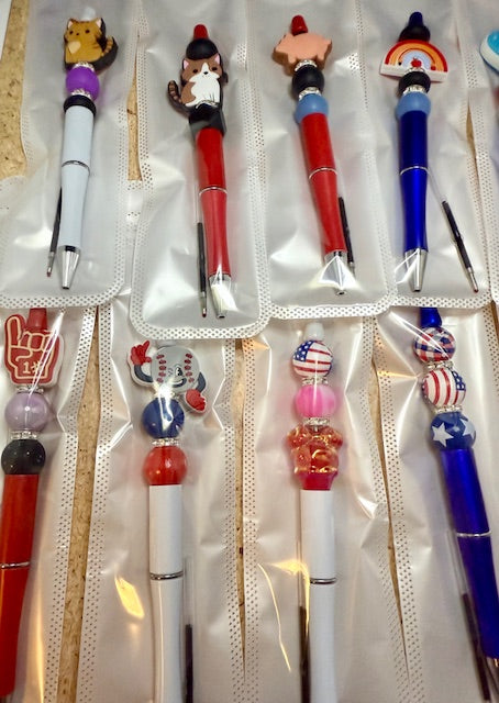 Riley's mystery pen or keychain item
