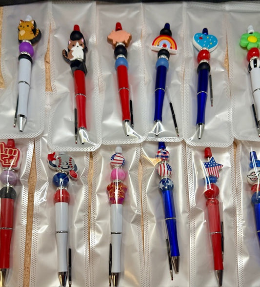 Riley's mystery pen or keychain item